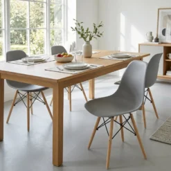 Sedia da pranzo Grigia in Polipropilene con gambe in legno di Faggio Nordica